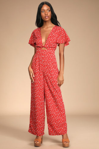 A floral red jumpsuit and brown platform heels.