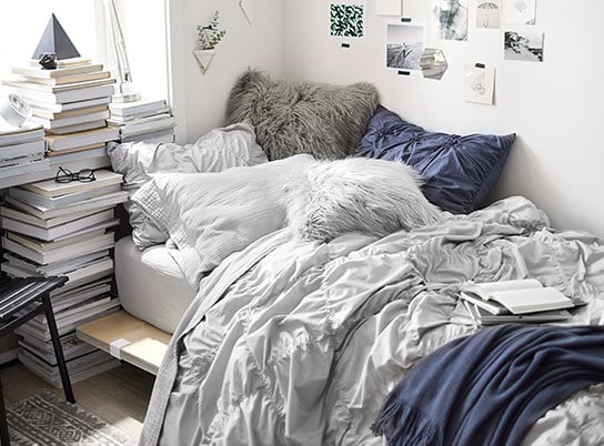 Blue, gray and white dorm room