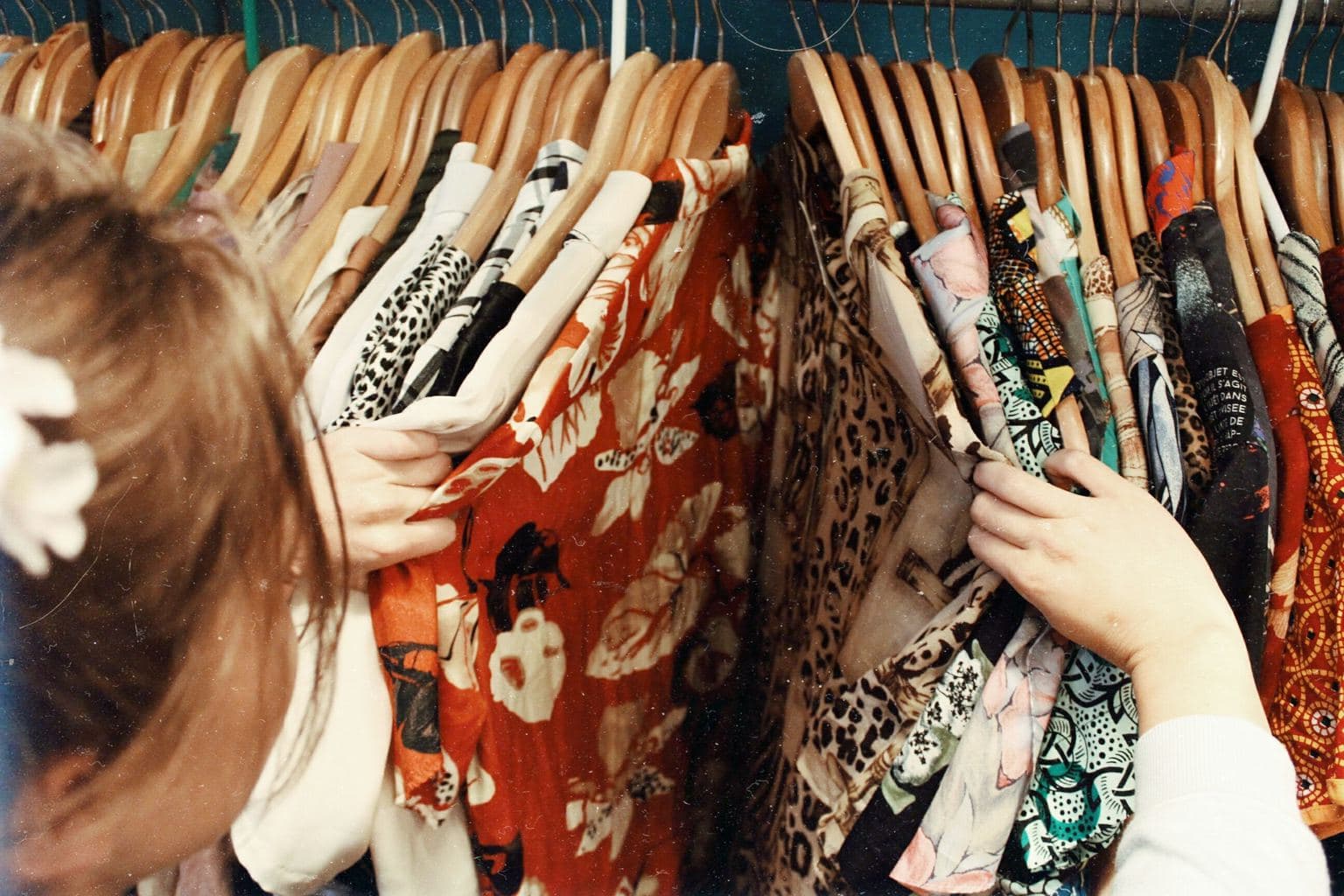 college girl looking through her closet